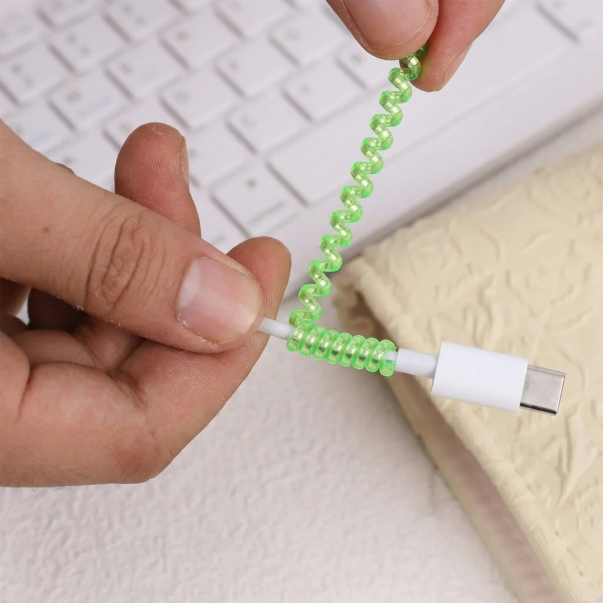 Durable cable protector sleeve, cord saver for mobile, black, protecting cords from wear.